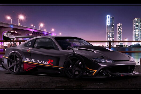 Coche deportivo negro tuningonny en la ciudad de la noche