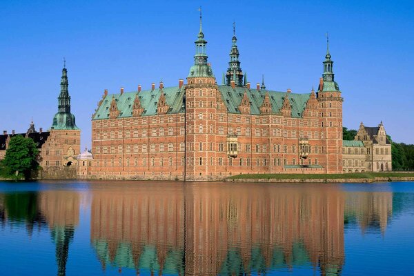 Reflection of the castle in the blue water