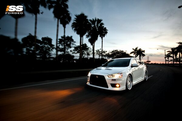 Mitsubishi car on the evening road