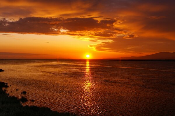 Bright orange sunset on the beach