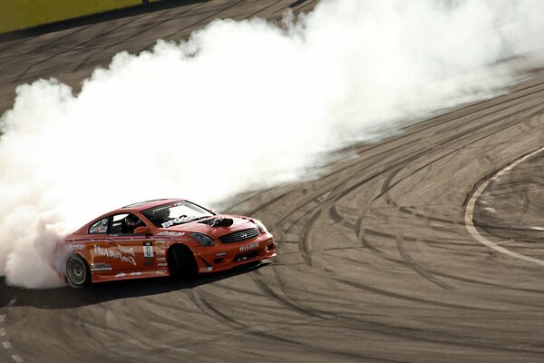 Red infiniti sports car, g35 in drift on the road