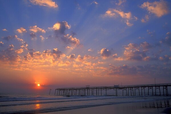 Florida pier, sunset and clouds