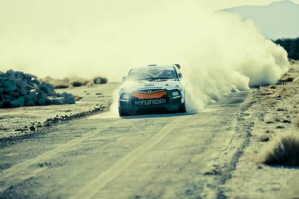 Hyundai flying on a high-speed rally in a cloud of dust