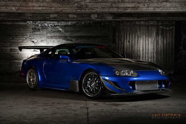 Toyota Supra blue in semi-darkness