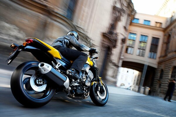 Yamaha motorcycle racer at speed in a turn