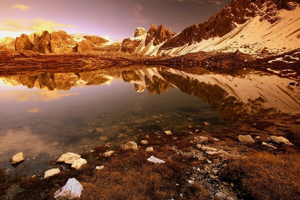 The lake in which the rocks are reflected