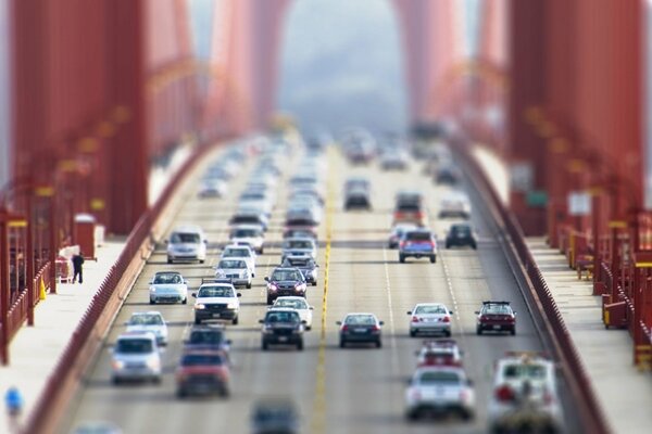 The big bridge. A huge flow of cars on the bridge