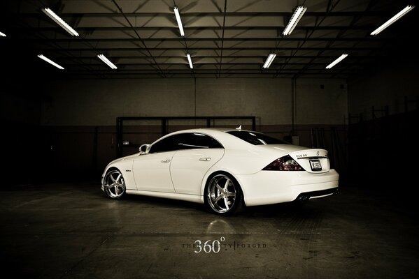 Tuned white car with forged wheels