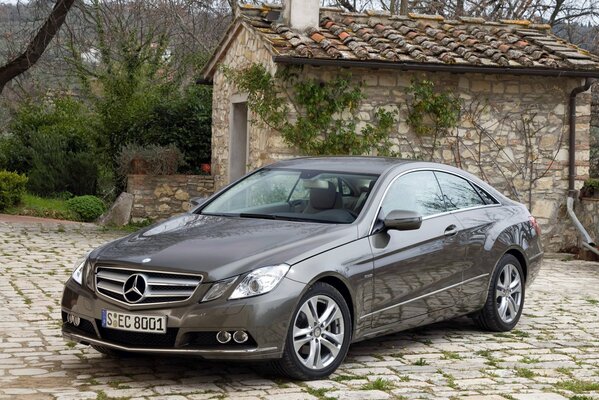 Service Mercedes on the background of delivery and paving stones