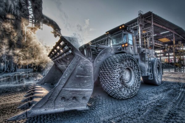 Art bulldozer with bucket and big wheels