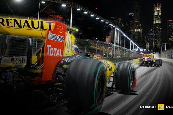 Racing cars racing on the night track