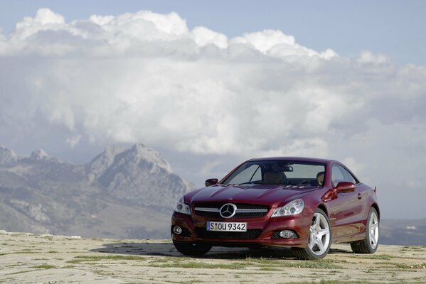 Burgundy car in the vast expanses