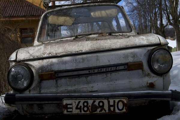 An old Zaporozhets on a winter road