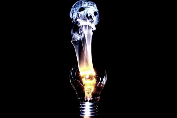 A broken light bulb from which the spirit is visible