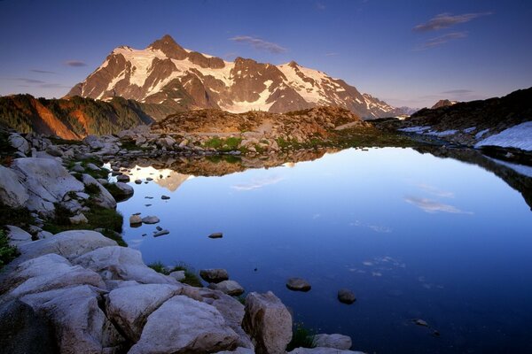 Blue lake in a ring of stones