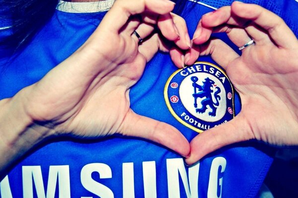 A heart made up by hands on a Chelsea FC T-shirt
