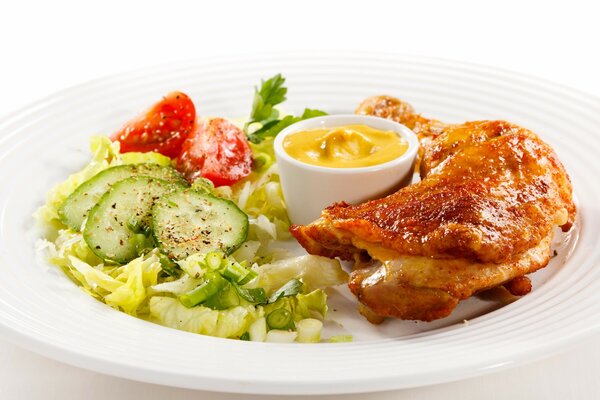 Delicious lunch chicken leg and salad