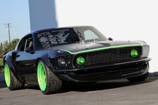 Tuned Ford Mustang with green wheels