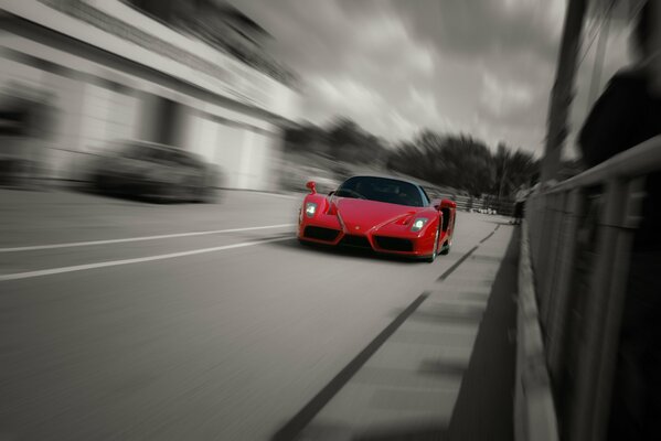 Red Ferrari under the sultry sun