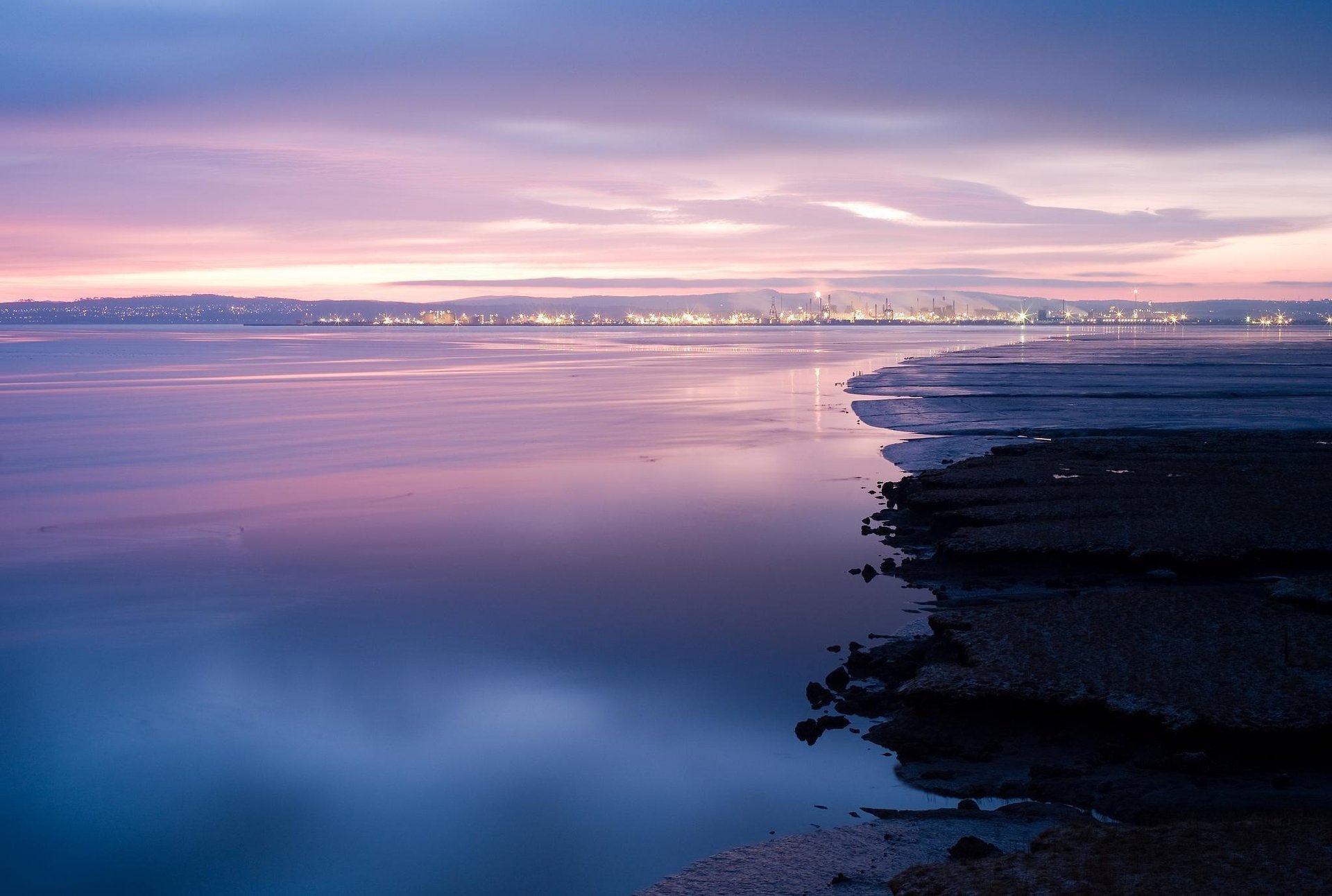 the city lake lights the evening bay shore