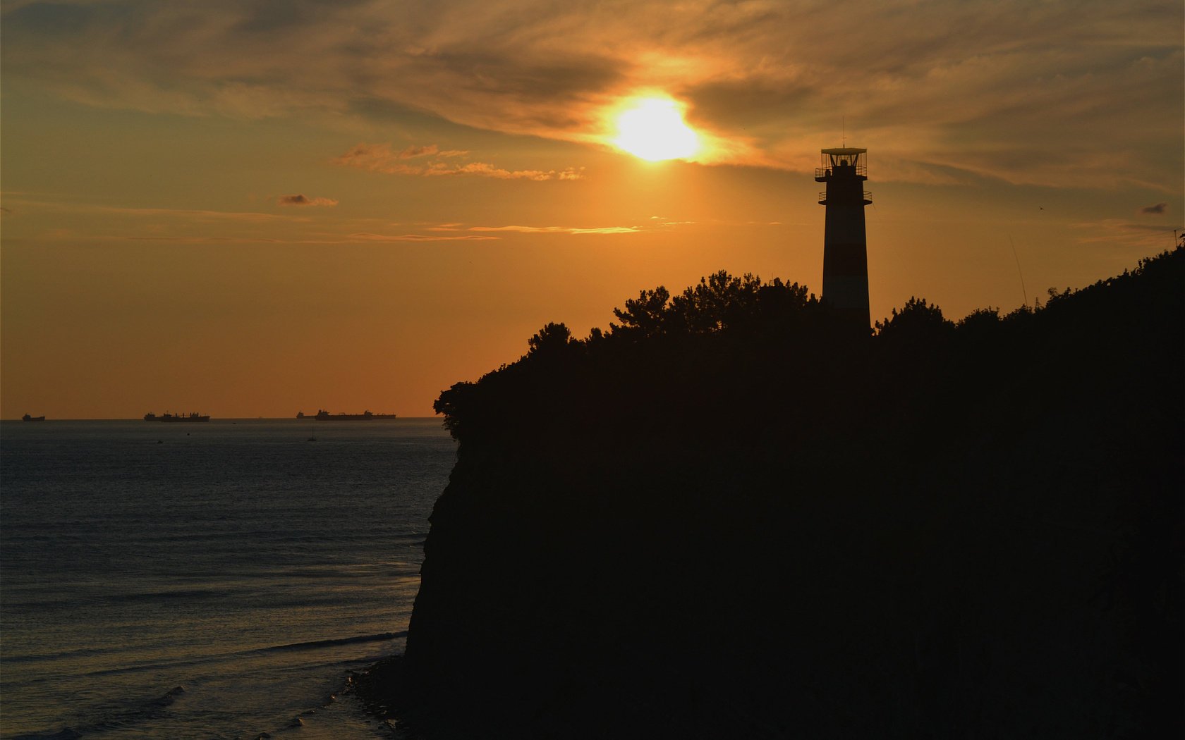 unset lighthouse nature sea