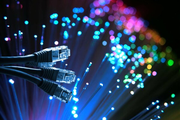 Network cables on a black background with multicolored lights