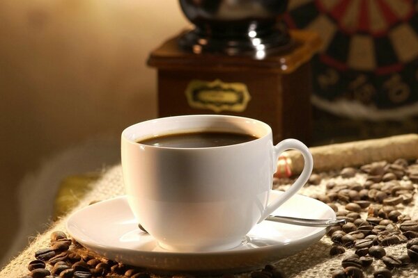 Fragrant mug of black ground coffee