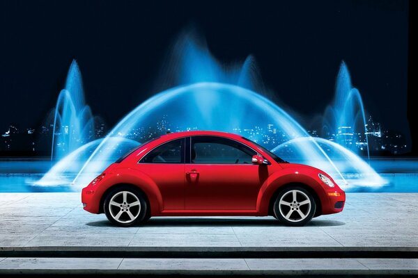 A small beetle car on the background of picturesque fountains