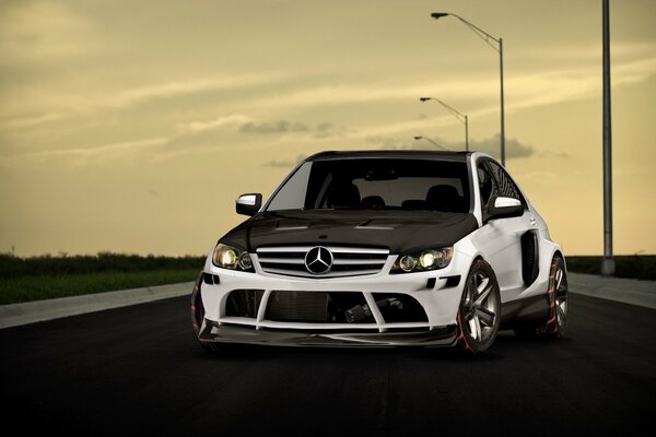 Cool black and white Mercedes on the road