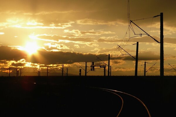 Evening road along the wires