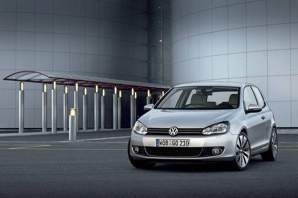 Silver volkswagen golf on the road