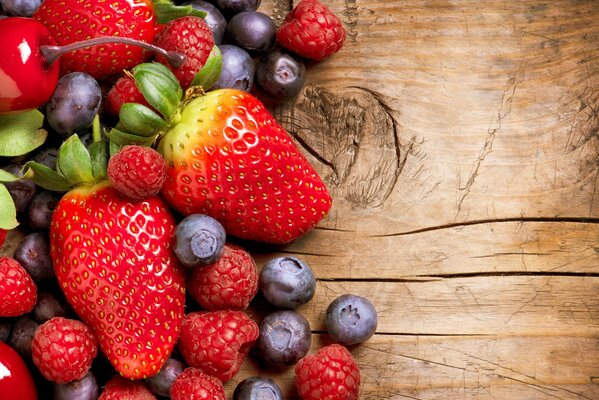 Wild berries on a wooden tray