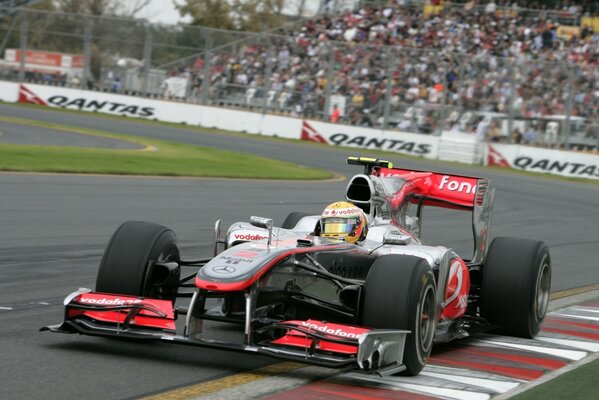 Formula 1 car on the race track with the audience