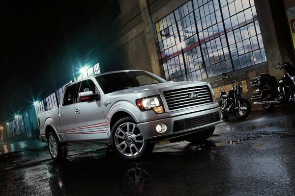 Ford pickup truck at night on the background of lanterns