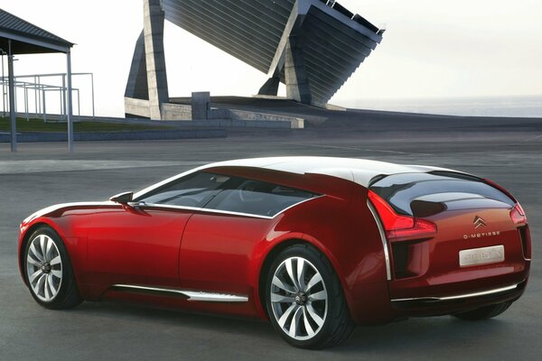 Full-length rear view of a red citroen