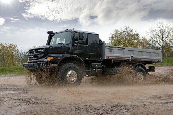 Powerful Mercedes truck kneads mud