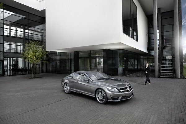 Silver Mercedes on the site near the building