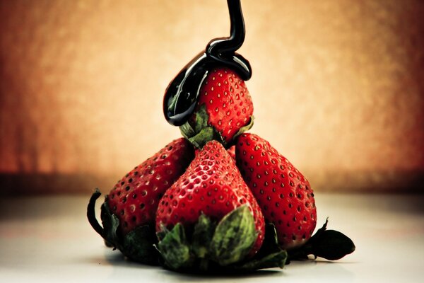 A beautiful dessert of strawberries in chocolate