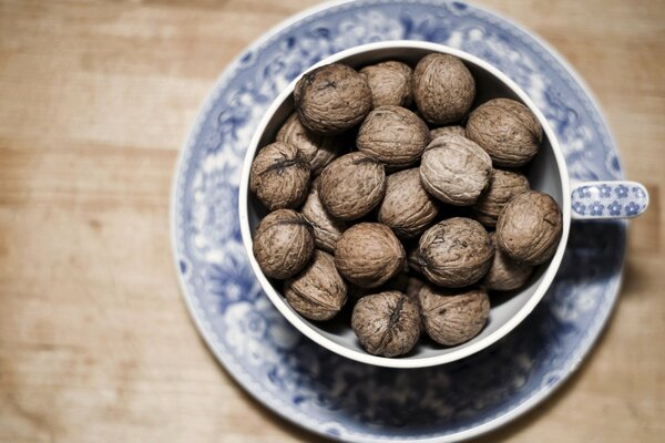 A full mug of nuts on the table