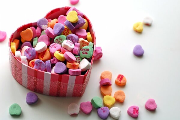 Colorful candies in a heart-shaped box