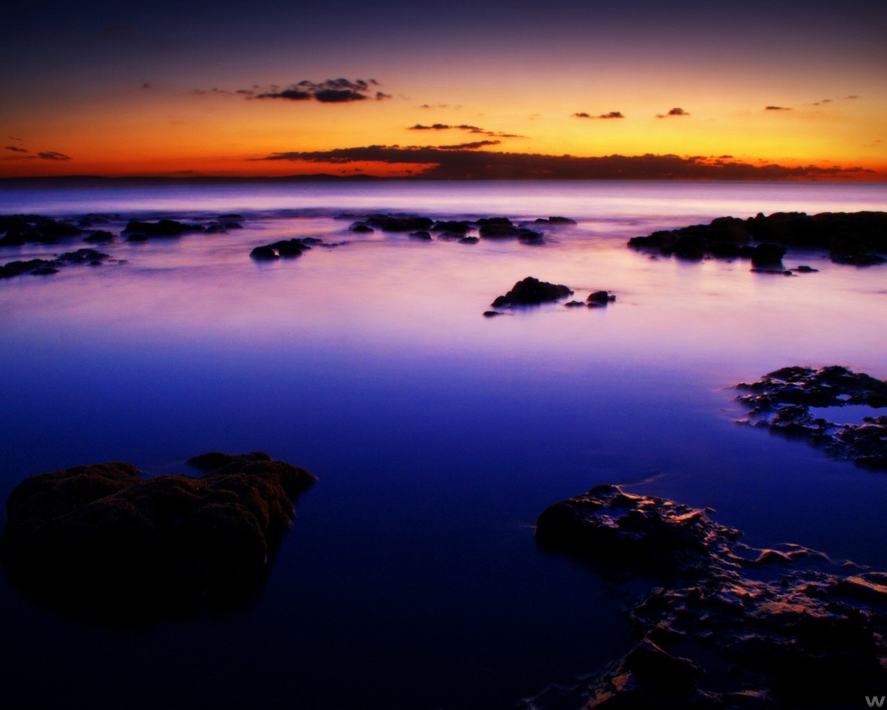 puesta de sol nubes piedras