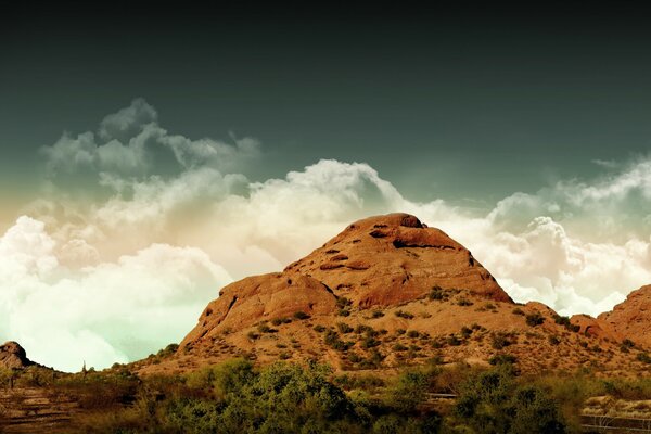 Mountains against clouds at dawn