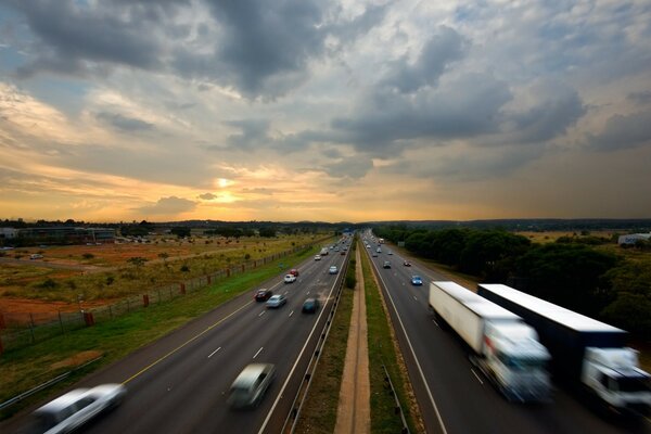 Fast moving cars on the highway