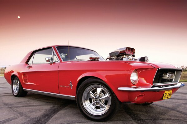 Beautiful red Ford at sunset