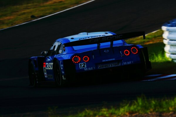 Blue racing car on the track