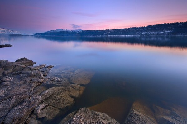 Mountain lake at pink sunset