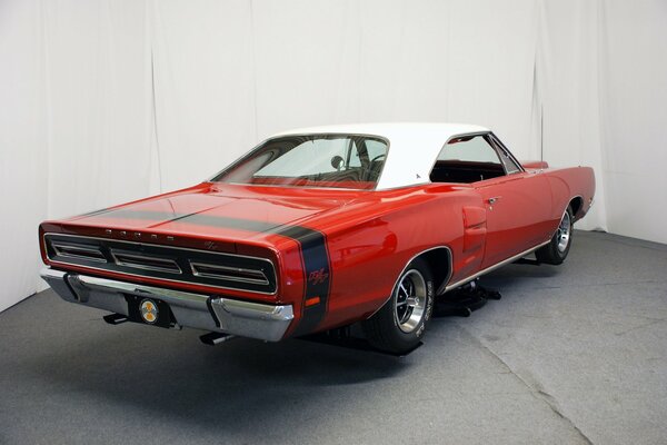 Red car on a white wall background