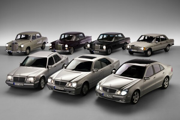 A lot of Mercedes-Benz cars on a gray background