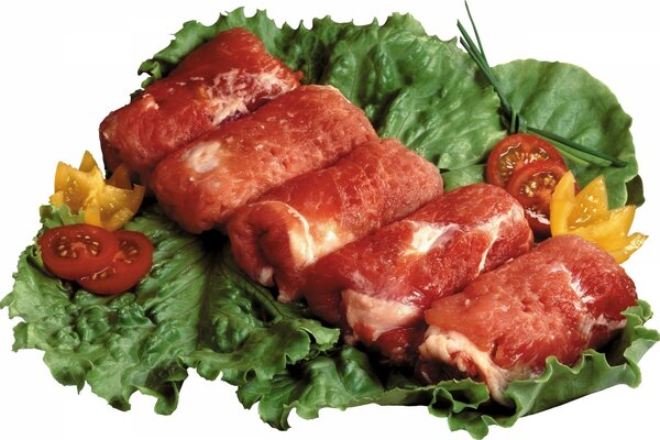 Meat rolls on a salad leaf