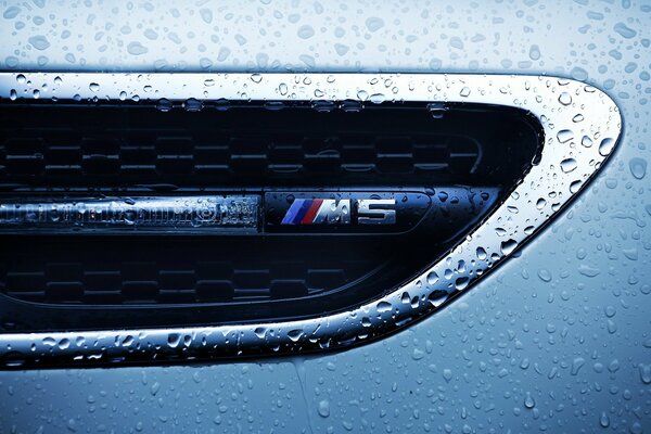 Macro shooting of a BMW with water drops